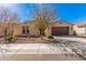 Charming single-story home featuring a two-car garage, low maintenance landscaping and desert-friendly plants at 3687 E Blue Spruce Ln, Gilbert, AZ 85298
