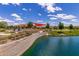 Pond view with walking path, playground, and covered picnic areas provides a gathering place at 3687 E Blue Spruce Ln, Gilbert, AZ 85298