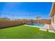 Beautiful pool and patio area with a waterfall feature at 3687 E Blue Spruce Ln, Gilbert, AZ 85298