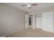 Bedroom featuring ceiling fan, carpet flooring, standard closet and an adjoining bathroom at 3756 E Camden Ave, San Tan Valley, AZ 85140