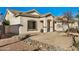 Inviting home exterior with desert landscaping, tile roof and covered front entryway at 3756 E Camden Ave, San Tan Valley, AZ 85140