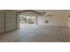 Spacious two car garage with concrete flooring and an open door at 3756 E Camden Ave, San Tan Valley, AZ 85140