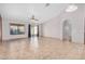 Bright and airy living room boasting tile floors, a ceiling fan, and sliding glass doors at 3756 E Camden Ave, San Tan Valley, AZ 85140