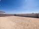 Large dirt backyard with block wall, offering a blank canvas for customization at 3806 N Camden Dr, Florence, AZ 85132