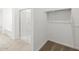 Bathroom view showcases a glass shower, tiled floor and small walk-in closet at 3806 N Camden Dr, Florence, AZ 85132
