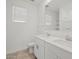 Bathroom featuring double sink vanity, tile flooring and large mirror at 3806 N Camden Dr, Florence, AZ 85132