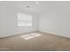 Bedroom featuring a window for natural light and neutral carpet at 3806 N Camden Dr, Florence, AZ 85132