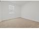Bedroom with plush carpet, a large window, and fresh white walls at 3806 N Camden Dr, Florence, AZ 85132
