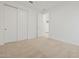 Bedroom with plush carpet, fresh white walls, and closet at 3806 N Camden Dr, Florence, AZ 85132