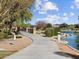 A scenic view of a small bridge and walking path within this community, near a beautiful pond on a clear day at 3806 N Camden Dr, Florence, AZ 85132