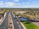 Welcoming entrance to the community featuring a beautifully landscaped median, community sign, and convenient road access at 3806 N Camden Dr, Florence, AZ 85132