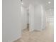 Hallway featuring neutral tile floors and white walls leading to other rooms in the home at 3806 N Camden Dr, Florence, AZ 85132