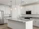 Kitchen with stainless steel appliances, granite counters, and a large island at 3806 N Camden Dr, Florence, AZ 85132