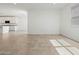 Living room area featuring tile flooring, light walls, and modern lighting at 3806 N Camden Dr, Florence, AZ 85132