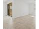 Bright living room with neutral tile floors, white walls and sliding glass door at 3806 N Camden Dr, Florence, AZ 85132