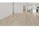 Spacious living room with neutral tile flooring, bright white walls and an open floorplan at 3806 N Camden Dr, Florence, AZ 85132