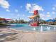 Vibrant splash park with fountains, a tipping bucket, and shady umbrellas, offering a refreshing retreat at 3806 N Camden Dr, Florence, AZ 85132