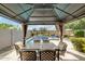 Backyard has covered dining area and beautiful swimming pool, perfect for entertaining at 3935 E Blue Spruce Ln, Gilbert, AZ 85298