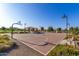 Outdoor community basketball court with well-maintained surface, benches, and covered picnic area in the background at 3935 E Blue Spruce Ln, Gilbert, AZ 85298