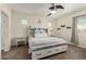 Bedroom features barn-door headboard, neutral tones, and plenty of storage space at 3935 E Blue Spruce Ln, Gilbert, AZ 85298