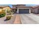 A well-maintained home featuring a spacious driveway and tidy landscaping enhances the property's appeal at 3935 E Blue Spruce Ln, Gilbert, AZ 85298