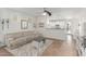 A comfortable living room with tile floors, modern decor, and a view of the open kitchen, inviting relaxation at 3935 E Blue Spruce Ln, Gilbert, AZ 85298