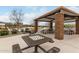 Covered picnic area with multiple tables and a built in chessboard on the tables at 3935 E Blue Spruce Ln, Gilbert, AZ 85298