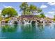 Picturesque water feature at The Bridges in Gilbert, Arizona, with waterfalls cascading into a serene lake at 3935 E Blue Spruce Ln, Gilbert, AZ 85298