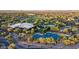 Aerial view of community amenities including pool, tennis courts, and green spaces at 3935 E Rough Rider Rd # 1368, Phoenix, AZ 85050