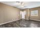 Bright bedroom featuring tile flooring, neutral colors, and windows with shutters for light control and privacy at 3935 E Rough Rider Rd # 1368, Phoenix, AZ 85050