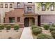 Charming townhome with a well-manicured front yard and inviting entrance, offering curb appeal and warmth at 3935 E Rough Rider Rd # 1368, Phoenix, AZ 85050
