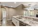 Kitchen with granite countertops, stainless steel sink and appliances, and breakfast bar at 3935 E Rough Rider Rd # 1368, Phoenix, AZ 85050