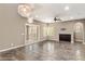 Spacious living room with tile floors, ceiling fan, and bright natural light at 3935 E Rough Rider Rd # 1368, Phoenix, AZ 85050