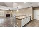 Open-concept living room with a breakfast bar, and modern lighting at 3935 E Rough Rider Rd # 1368, Phoenix, AZ 85050