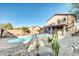 Private backyard pool with desert landscaping and privacy fence at 42015 W Hillman Dr, Maricopa, AZ 85138