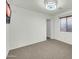 Neutral carpeted bedroom with good natural light and ceiling fan at 42015 W Hillman Dr, Maricopa, AZ 85138