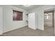 Cozy bedroom featuring a built-in wardrobe, study desk, and neutral decor at 42015 W Hillman Dr, Maricopa, AZ 85138
