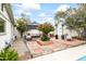 Inviting backyard with a relaxing lounge area, a fire pit, and mature trees for shade and privacy at 4308 E Montecito Ave, Phoenix, AZ 85018
