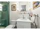 Bright bathroom featuring a modern vanity, shower, framed art, and a stylish towel rack at 4308 E Montecito Ave, Phoenix, AZ 85018