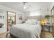Bright bedroom with neutral tones, ceiling fan, and access to sunroom at 4308 E Montecito Ave, Phoenix, AZ 85018
