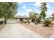 Charming home featuring a spacious driveway, two-car garage, beautiful landscaping, and a welcoming front entryway at 4308 E Montecito Ave, Phoenix, AZ 85018