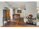 Bright living room featuring an antique cabinet, stylish bar, and fireplace at 4308 E Montecito Ave, Phoenix, AZ 85018