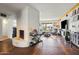 Expansive living room featuring a stylish entertainment center, a cozy fireplace, and comfortable seating for modern living at 4308 E Montecito Ave, Phoenix, AZ 85018