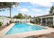 A lovely backyard with a large in-ground pool, shaded seating, and lush landscaping at 4308 E Montecito Ave, Phoenix, AZ 85018