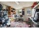 A unique spare room furnished with gear and equipped with mounted storage and barstool seating at 4308 E Montecito Ave, Phoenix, AZ 85018