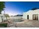 Private backyard with refreshing pool, brick-paved patio, tall fencing, and desert landscaping at 4731 E Monte Vista Rd, Phoenix, AZ 85008