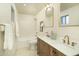 Bright bathroom featuring a soaking tub and dual sink vanity with modern fixtures at 4731 E Monte Vista Rd, Phoenix, AZ 85008