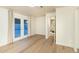 Bedroom features a glass door to patio, wood floors and neutral paint with bright light at 4731 E Monte Vista Rd, Phoenix, AZ 85008