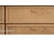 Close up image of custom wood cabinetry with sleek brass handles at 4731 E Monte Vista Rd, Phoenix, AZ 85008