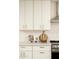 Well-organized kitchen with white cabinets, quartz countertops, and modern stainless steel appliances at 4731 E Monte Vista Rd, Phoenix, AZ 85008